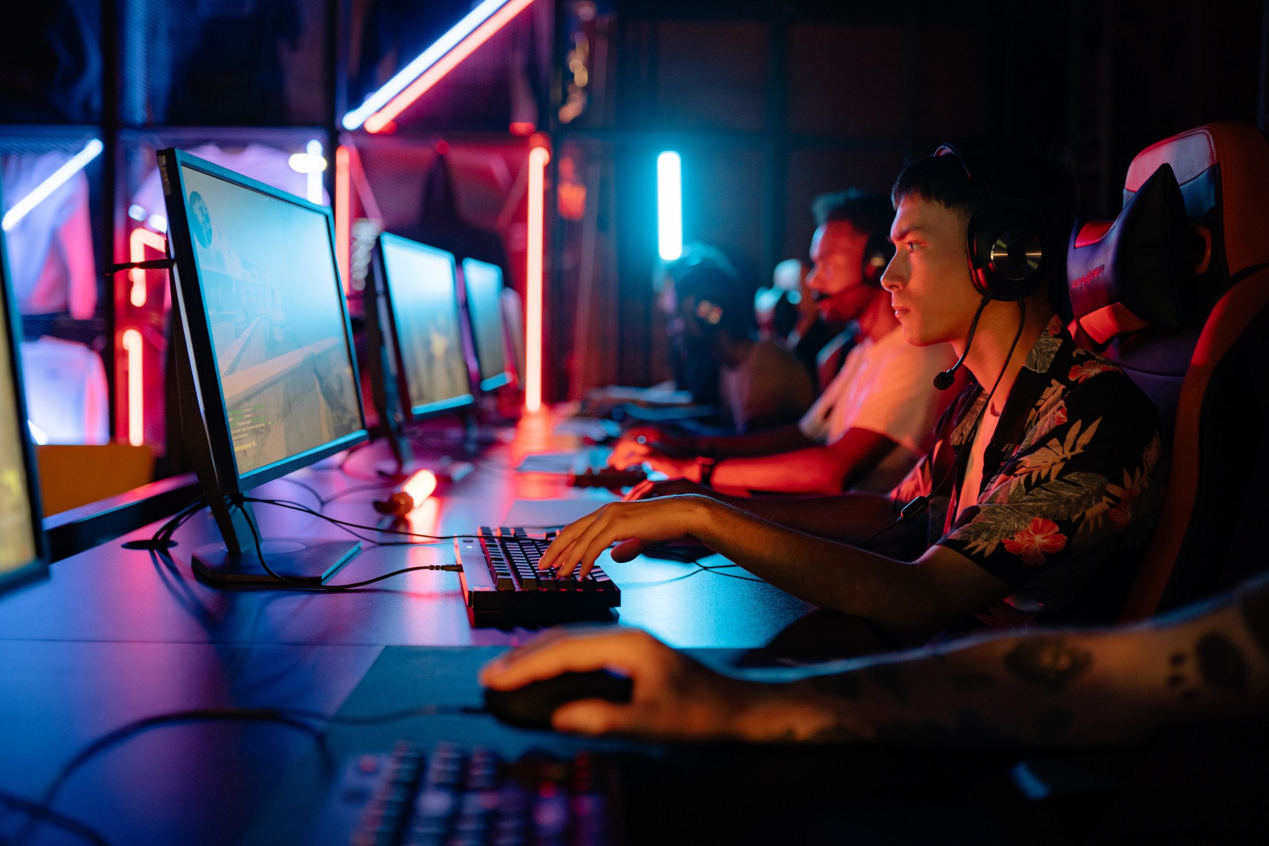 group of men playing esports on computers